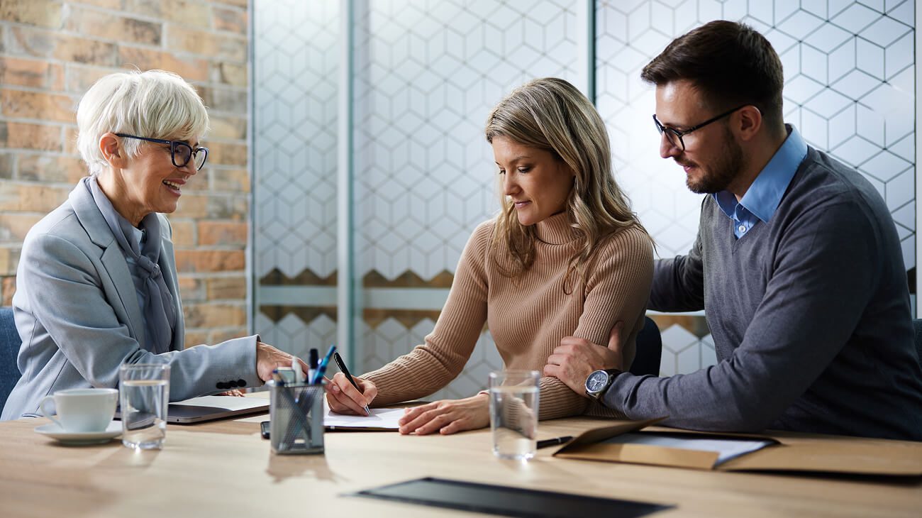 Couple consulting with financial advisor