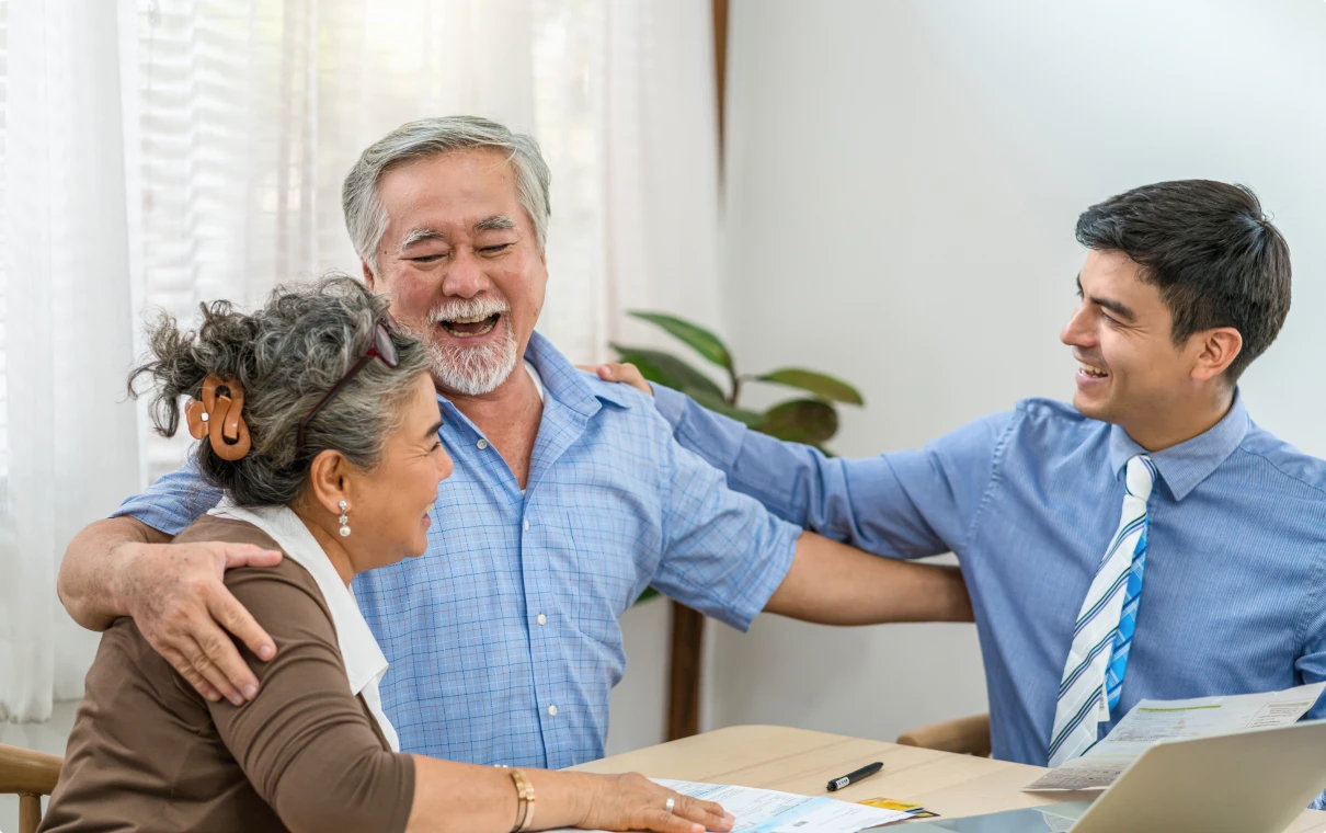 Advisor meeting with smiling senior clients