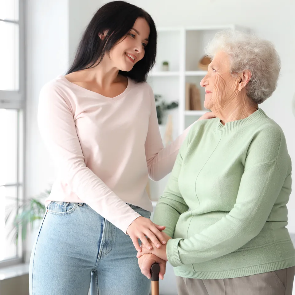 An older woman receiving support at home